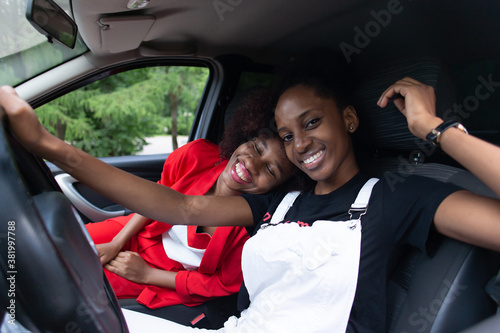 two African American women having fun in the car