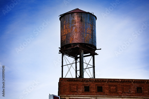 Fényképezés Metal steel water tower on top of the building in Detroit