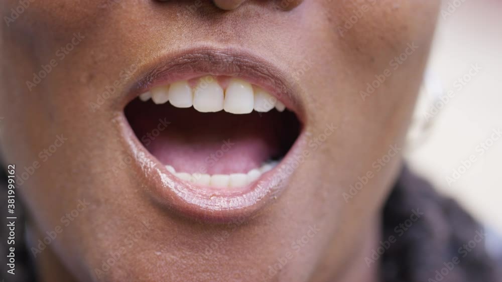 Close up shot of black female talking to camera with a cheerful expression