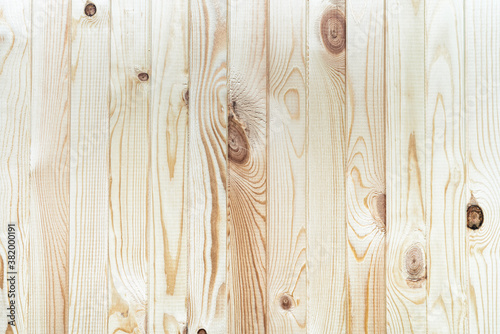 Structure wooden plank light brown background with vertical boards. Flat lay close-up view.