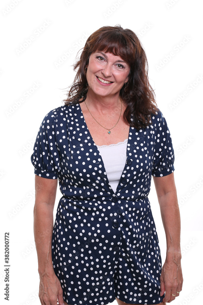 Beautiful mature woman in front of a background Beautiful mature woman in front of a background