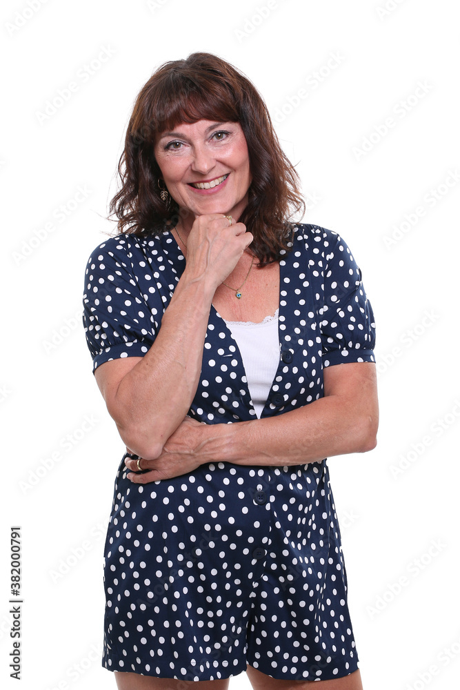 Beautiful mature woman in front of a background Beautiful mature woman in front of a background