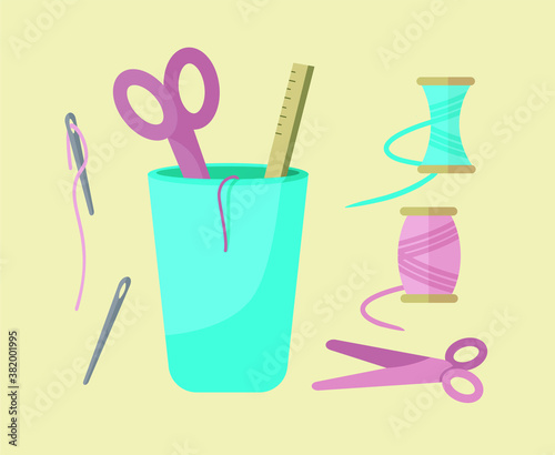 set of tools for sewing with threads, scissors, needles, glass for tools, spool with threads, ruler