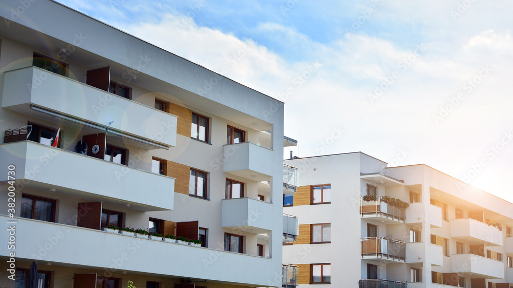 Apartment residential house and home facade architecture and outdoor facilities. Blue sky on the background. Sunlight Apartment residential house and home facade architecture and outdoor facilities. Blue sky on the background. Sunlight
