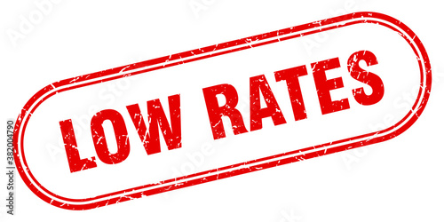 low rates stamp. rounded grunge textured sign. Label