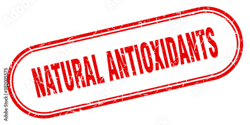 natural antioxidants stamp. rounded grunge textured sign. Label