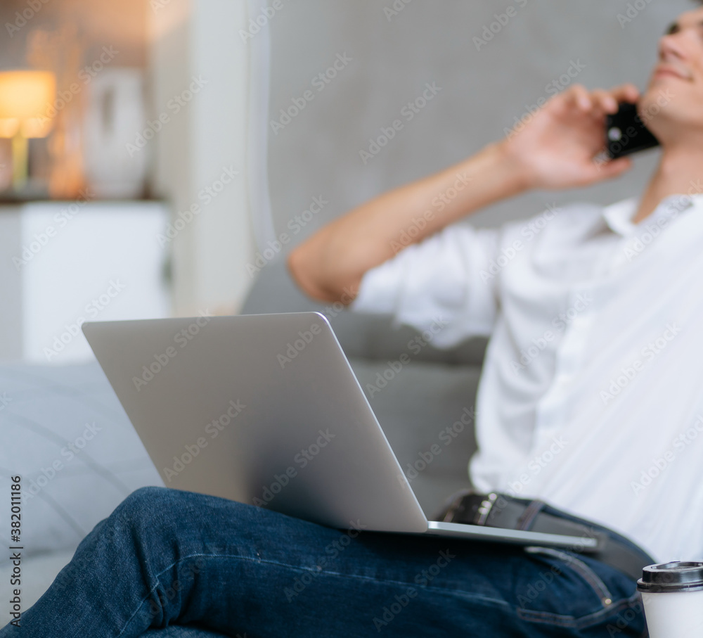 Fototapeta premium close up. young entrepreneur is talking on a smartphone.