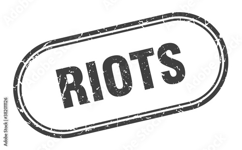 riots stamp. rounded grunge textured sign. Label