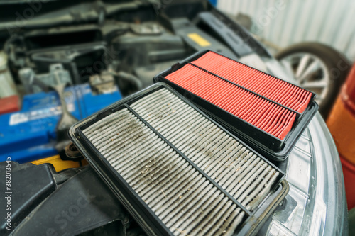 Used dirty Air Filter and New one, timely maintenance and service of your car.