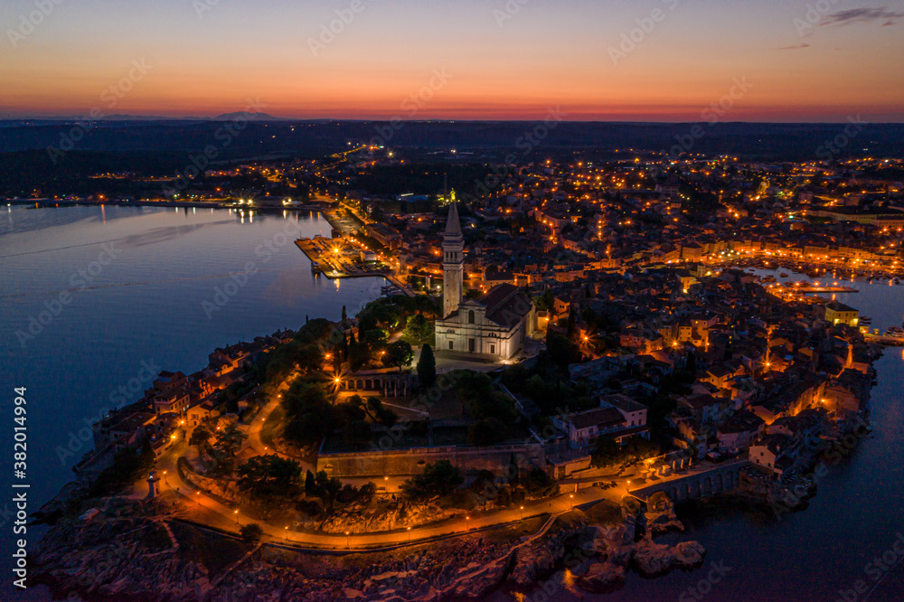 Naklejka premium Panoramic aerial drone picture of the historic city Rovinj in Croatia during sunrise