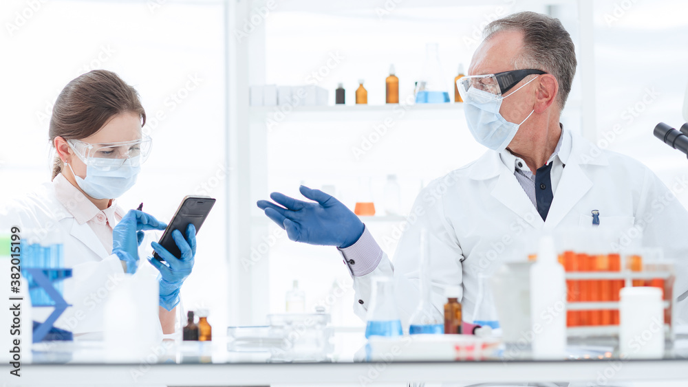 scientist and a laboratory assistant work in a medical laboratory scientist and a laboratory assistant work in a medical laboratory