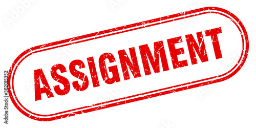 assignment stamp. rounded grunge textured sign. Label