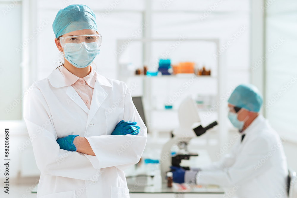 close up. female scientist standing in the lab. close up. female scientist standing in the lab.