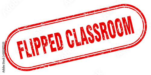 flipped classroom stamp. rounded grunge textured sign. Label