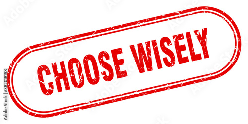 choose wisely stamp. rounded grunge textured sign. Label