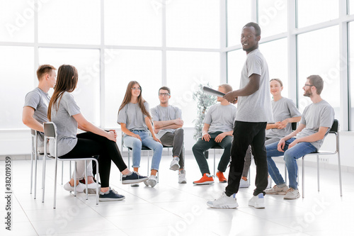 business coach and a group of young people at a seminar in the conference room