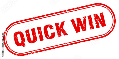 quick win stamp. rounded grunge textured sign. Label