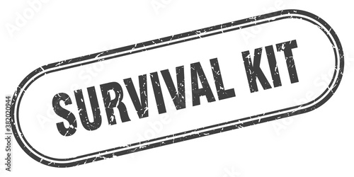 survival kit stamp. rounded grunge textured sign. Label
