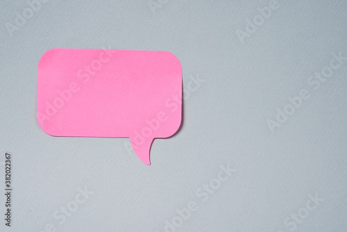 Pink label notification sticker on gray background Copy Space
