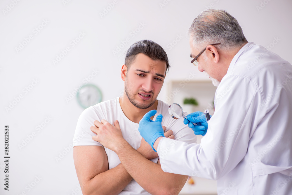 Young man visiting experienced doctor dermatologist Young man visiting experienced doctor dermatologist