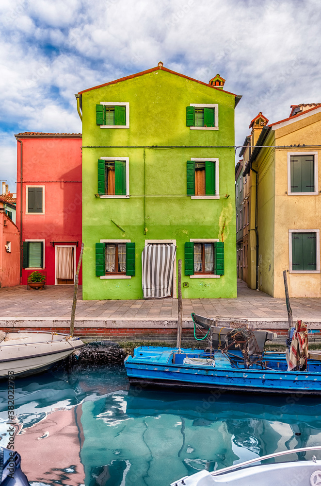 Colorful houses along the canal, island of Burano, Venice, Italy