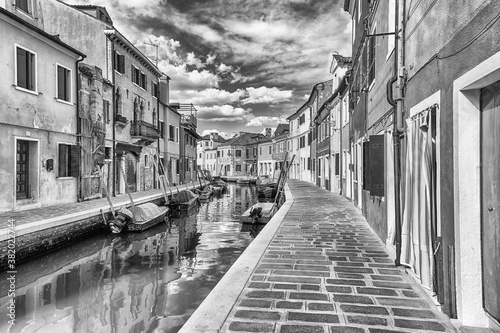 Picturesque architecture along the canal, island of Burano, Venice, Italy © marcorubino