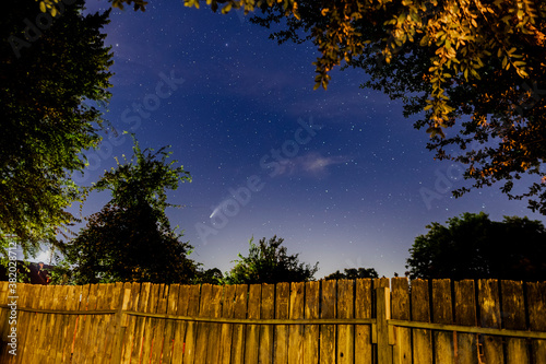comet over fence and stars