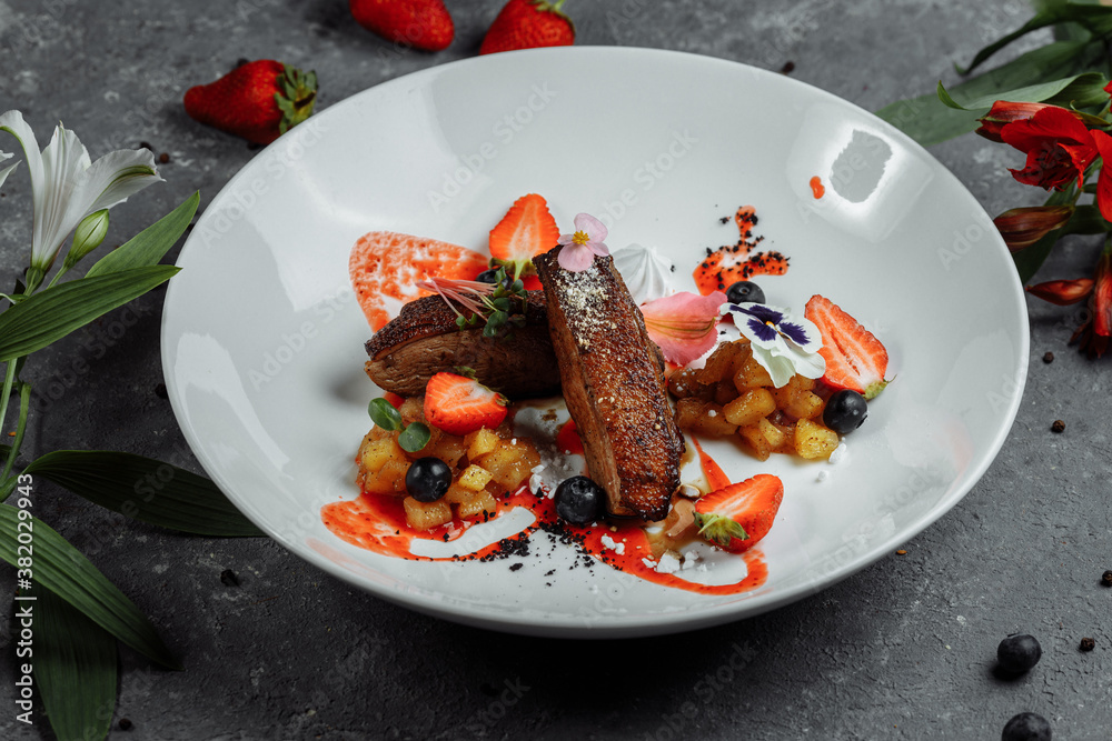 Duck breast with strawberry sauce. bon appetit. Duck breast, strawberry sauce, apple salsa with cinnamon, berries. top food background. copy space Duck breast with strawberry sauce. bon appetit. Duck breast, strawberry sauce, apple salsa with cinnamon, berries. top food background. copy space
