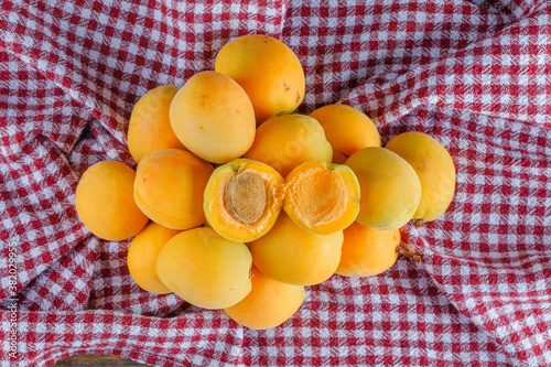 Apricots on a picnic cloth background. flat lay.