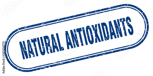 natural antioxidants stamp. rounded grunge textured sign. Label