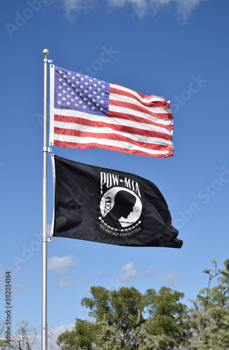 American and POW MIA flags in the wind