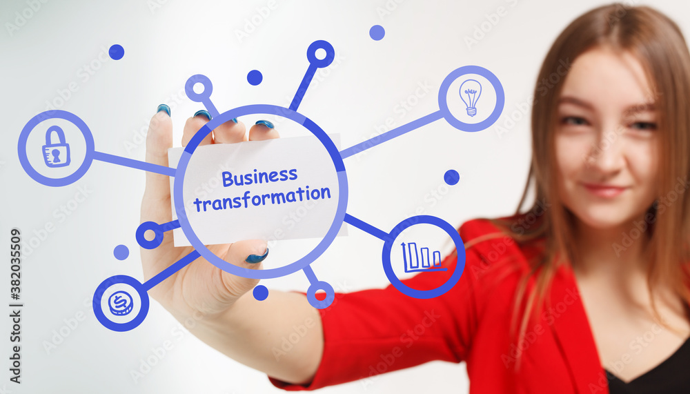 Business, Technology, Internet and network concept. Young businessman working on a virtual screen of the future and sees the inscription: Business transformation Business, Technology, Internet and network concept. Young businessman working on a virtual screen of the future and sees the inscription: Business transformation