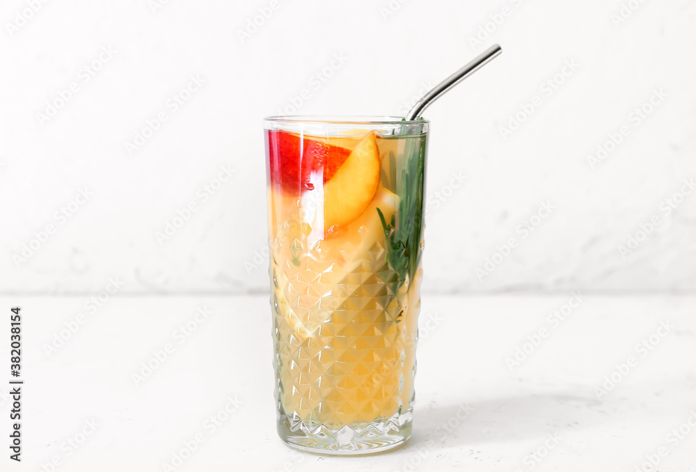Glass of fresh peach lemonade on table Glass of fresh peach lemonade on table