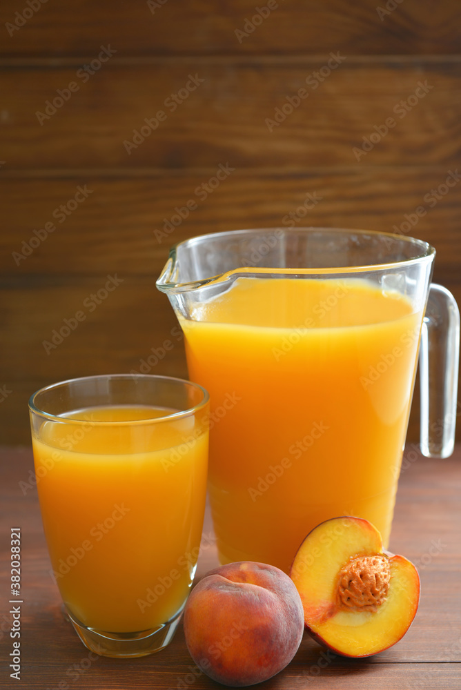 Composition with fresh peach juice on table Composition with fresh peach juice on table