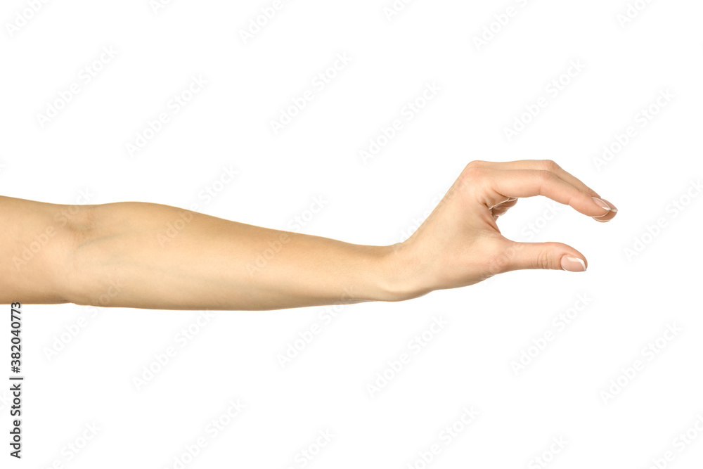 Measuring invisible item. Woman hand gesturing isolated on white Measuring invisible item. Woman hand gesturing isolated on white