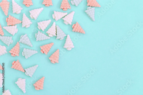 Wallpaper Mural Pastel cute candy sweets, in form of Christmas trees. New year background in mint pink tones with copy space. Top view. Torontodigital.ca