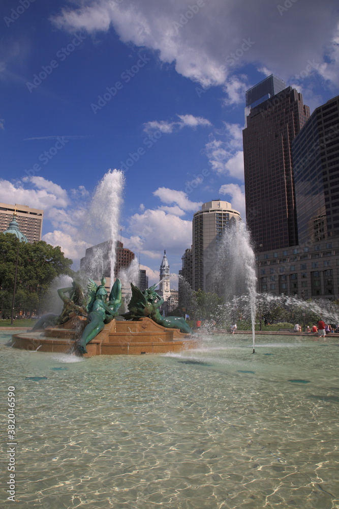 View of Philadelphia City Hall and cityscape with Skyscraper and  Swann Memorial Fountain at Logan square traffic circle during summer in Philadelphia
