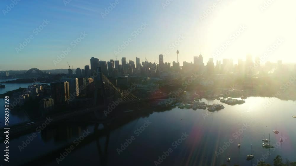 Aerial view approaching ANZAC Bridge and Sydney skyline during sunset Aerial view approaching ANZAC Bridge and Sydney skyline during sunset