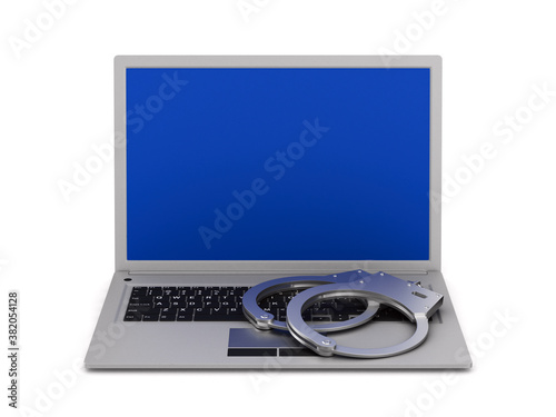 laptop and handcuff on whit...