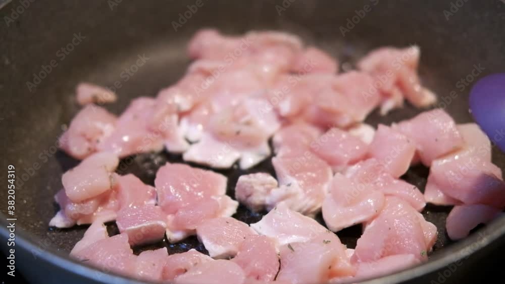 cooking chicken meat, roasting chicken meat in a pan in the kitchen by an italian cook.
Location: Italy cooking chicken meat, roasting chicken meat in a pan in the kitchen by an italian cook.
Location: Italy