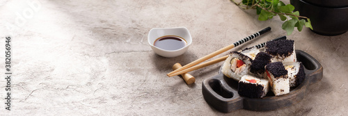 Japanese sushi food. Top view of sushi. Rolls with masaga caviar. Still life. Unusual composition of rolls.