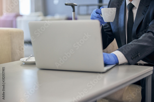 Businessman working on laptop in airport lounge © Svitlana