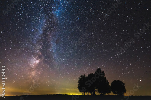Landscape with Milky way galaxy glowing in the night sky