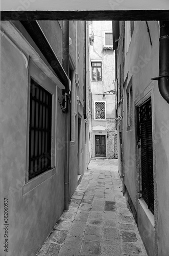 narrow black and white street in Venice