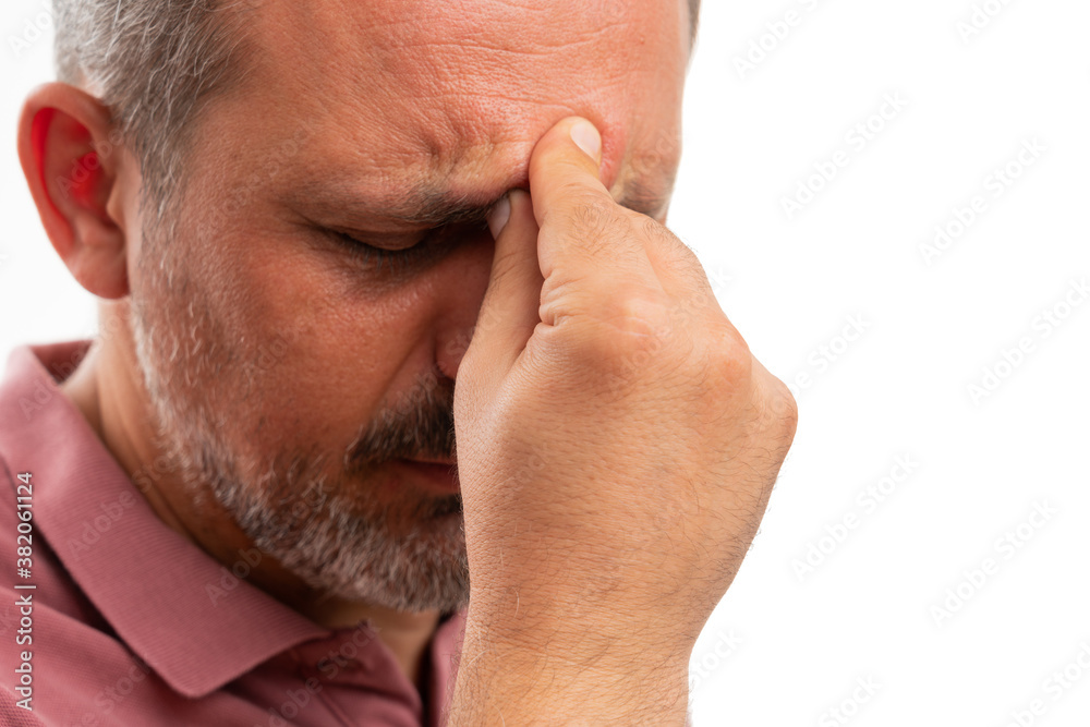 Close-up of man touching forehead as stressed thinking gesture Close-up of man touching forehead as stressed thinking gesture