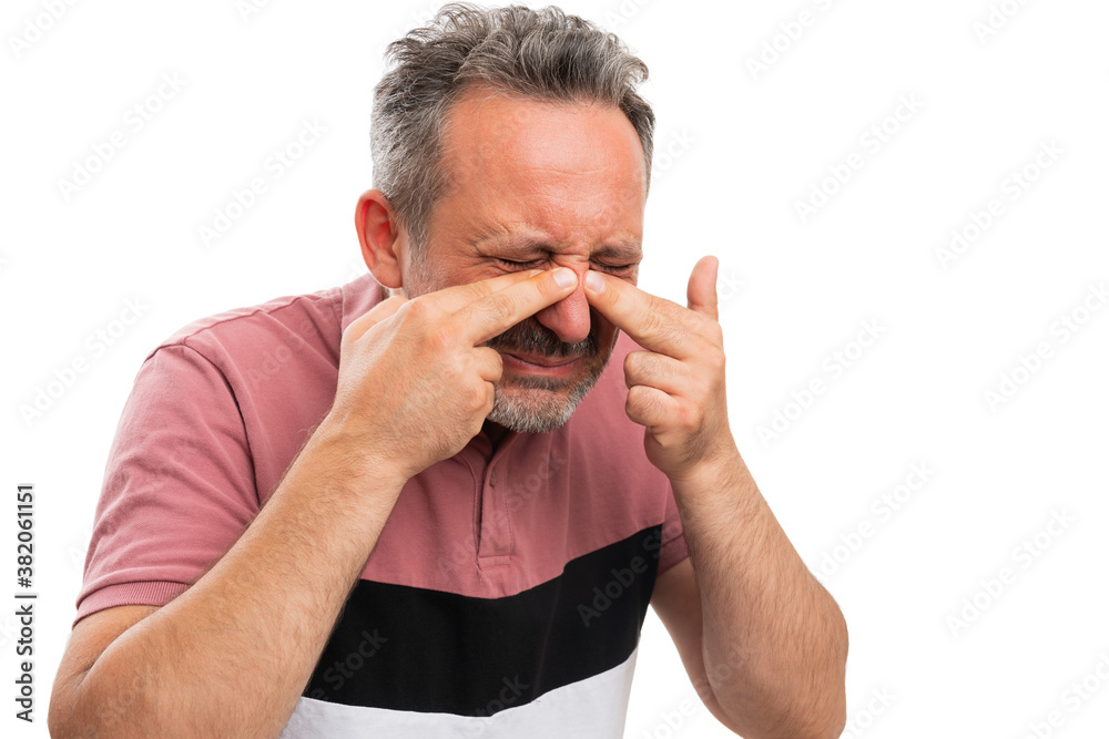 Obraz premium Sick man wearing tshirt touching nose as sinuses pain concept