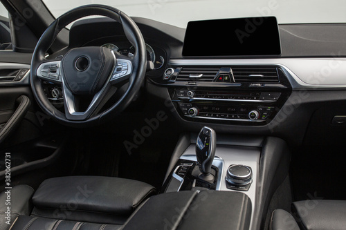 Modern suv car interior with leather panel, multimedia and dashboard © Moose