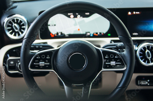 Modern car steering wheel detail close up