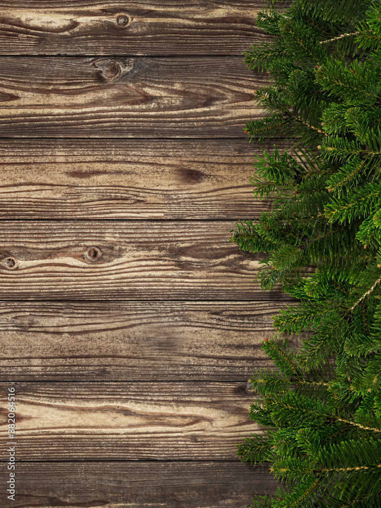 Fir tree branches and old wooden table Fir tree branches and old wooden table