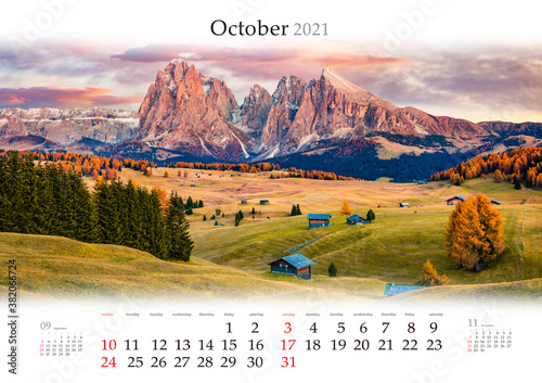 Calendar October 2021, B3 size. Set of calendars with amazing landscapes. Unbelievable sunrise on Alpe di Siusi mountain plateau with Langkofel (Sassolungo) mountain, Dolomite Alps, Italy